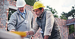 Contractor, discussion and people on construction site for floor plan, inspection or collaboration at table. Engineer, meeting and men with blueprint, brainstorming or architect design in morning