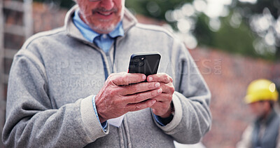 Buy stock photo Mature, man and hands with phone for construction, building communication or online chat on site. Closeup, male person or contractor typing with mobile smartphone for industrial development or app