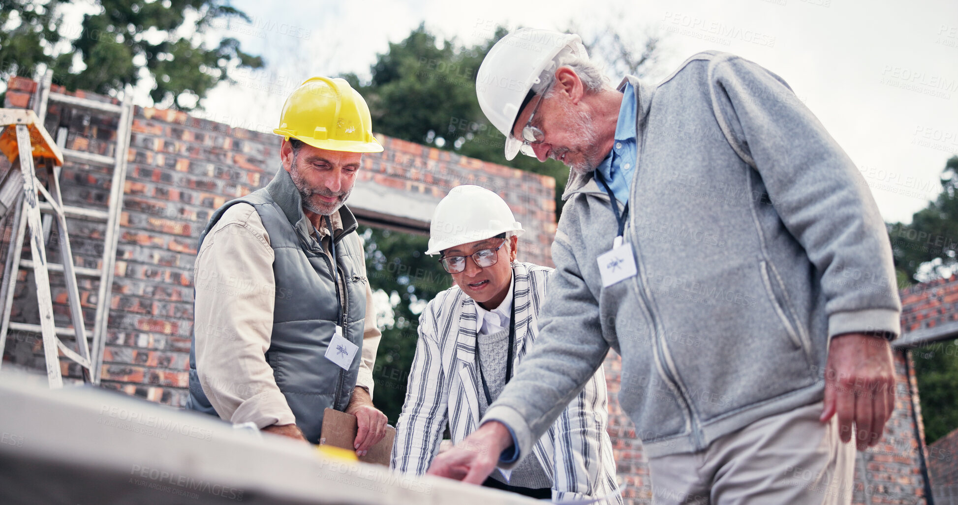Buy stock photo Construction site, people and discussion for floor plan, blueprint and idea for property development. Team, technology and contractor on worksite for project management, engineer and architect design