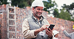 Construction site, smile and man with smartphone, typing and communication with property. Mature person, employee and inspector with cellphone, connection and building development with renovation