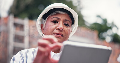 Buy stock photo Construction site, serious and woman with tablet, internet or communication with real estate. Mature person, low angle or property with tech, connection or building development with architecture
