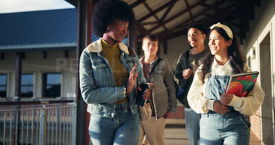 Friends, talking and students with walking in hallway for high school gossip, conversation and learning break. Education, people and happy with discussion outdoor for study tips and scholarship chat