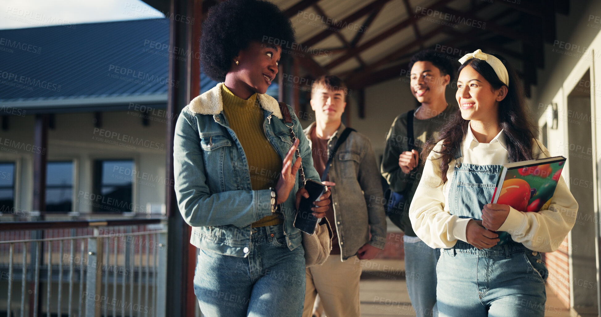 Buy stock photo Friends, talking and students with walking in hallway for high school gossip, conversation and learning break. Education, people and happy with discussion outdoor for study tips and scholarship chat