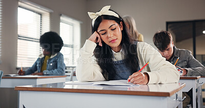 Buy stock photo Girl, writing and learning in classroom at high school with solution, problem solving or test. Teenager, notebook and education with scholarship, development or study with perspective at academy