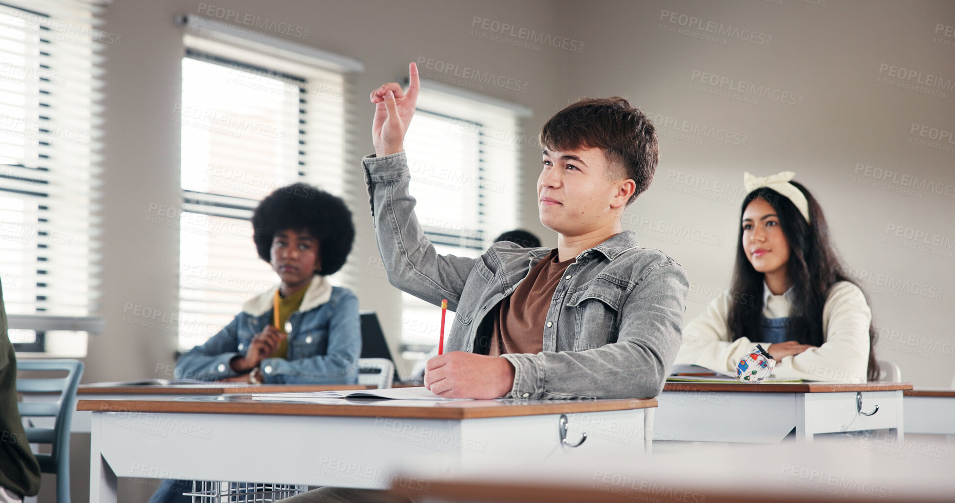 Buy stock photo Question, hands up and boy in classroom with answer for lesson, learning and education. High school, academy and students with gesture for asking, feedback and knowledge development for assessment