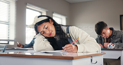 Buy stock photo Sleeping, school and girl in classroom at desk with boredom for writing assignment, test or quiz. College, university and exhausted student with fatigue for learning, education or studying for lesson