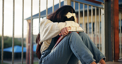Buy stock photo Girl, sad and lonely with crying at school with depression, bullying or social isolation on ground. Child, teenager and anxiety with books, mental health and education with scholarship at academy