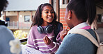 Girl, friends and talking at school, corridor and happy at break, listen and bonding with education. Kids, together and group for discussion, smile or books for scholarship, learning and development