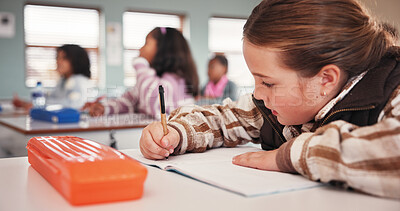 Buy stock photo Education, girl student and writing in classroom for motor skills, language activity and school assessment. Academy, learner and book for assignment, academic development and learning scholarship