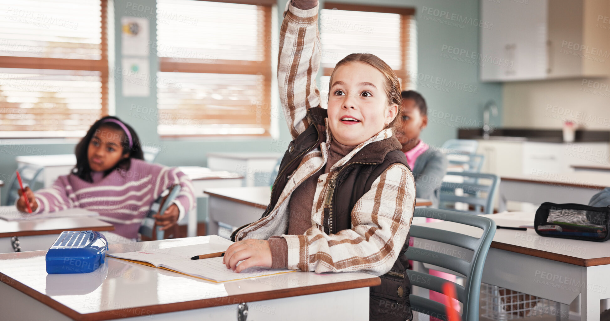 Buy stock photo Girl, raised hand and education in classroom, smile or excited with answer, quiz or development at school. Kids, pupil and happy for solution, question or test for assessment with learning at academy