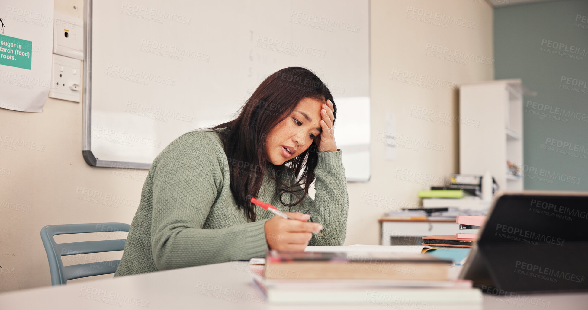 Buy stock photo Teacher, woman and stress with grading in classroom for academic workload, exam marking and test fail. Educator, person and headache at school for education burnout, admin tasks and tired of deadline