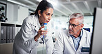 Teamwork, scientist and chemistry with mentor in laboratory for healthcare, medical research or test results. Man, woman and study with biologist, computer and solution for pharmaceutical development