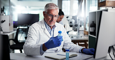 Buy stock photo Man, scientist or vial with computer for medical research, discovery or experiment at lab. Mature, male person or health worker in science with gloves or sample for chemistry, exam or test results