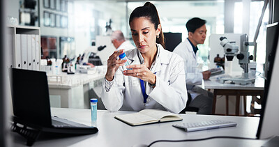 Buy stock photo Woman, scientist and vial with medical research for exam, test results or analysis at laboratory. Female person, science or book with chemical sample for scientific trial, experiment or new study