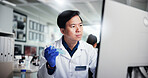 Man, scientist and vial with computer for medical research, discovery or data at laboratory. Male person, science and reading with exam, tests or samples for scientific experiment, trial or results
