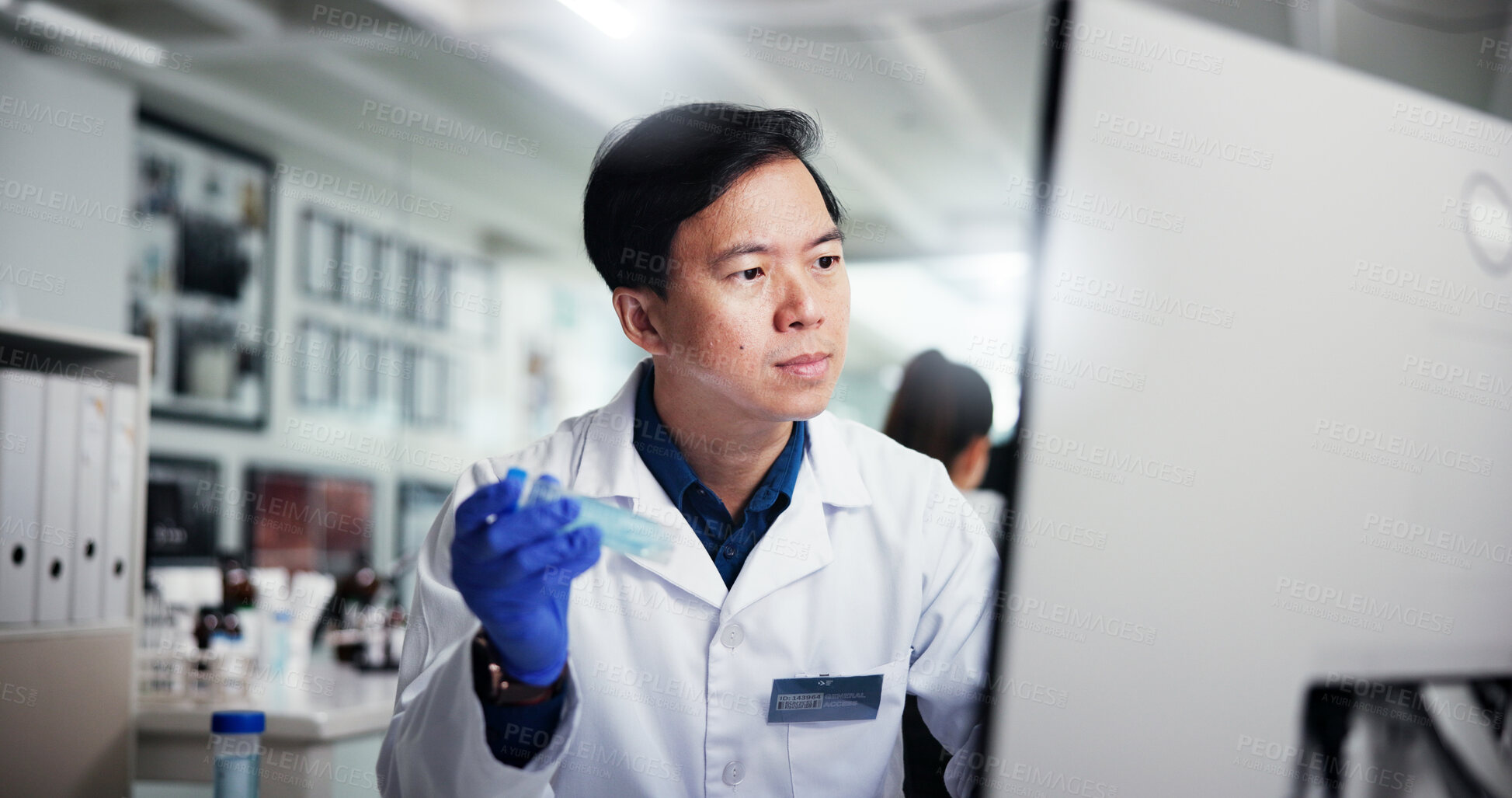 Buy stock photo Man, scientist and vial with computer for medical research, discovery or data at laboratory. Male person, science and reading with exam, tests or samples for scientific experiment, trial or results