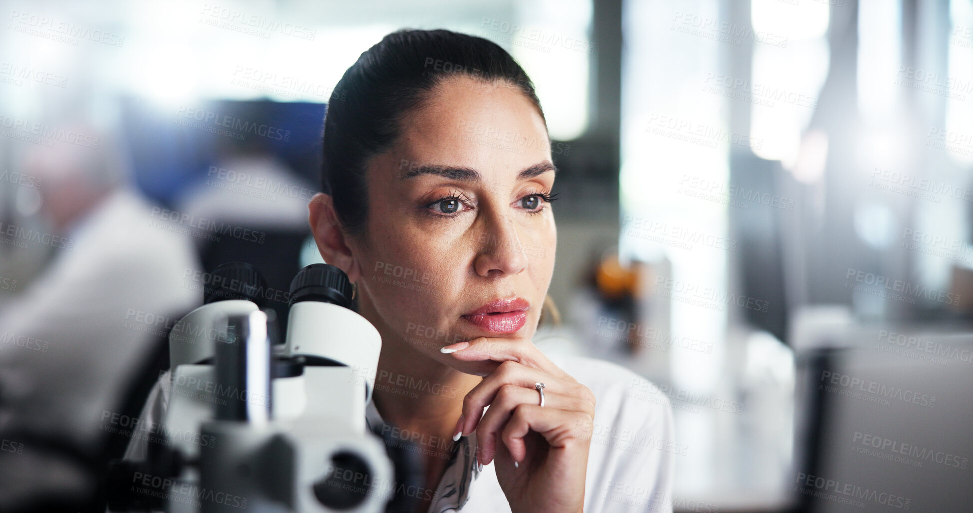 Buy stock photo Computer, scientist and study with woman with microscope for healthcare, medical research or test results. Tech, analysis or thinking with biologist in clinical trial for pharmaceutical development