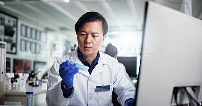 Buy stock photo Man, scientist or research with sample for experiment, medical trial or test results at laboratory. Male person, science or information with technology for new study, scientific exam or chemistry