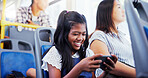 Happy girl, child and playing with phone on bus for games, entertainment or streaming in vehicle. Kid, traveler or smile with mobile smartphone in public transport for online app or subscription