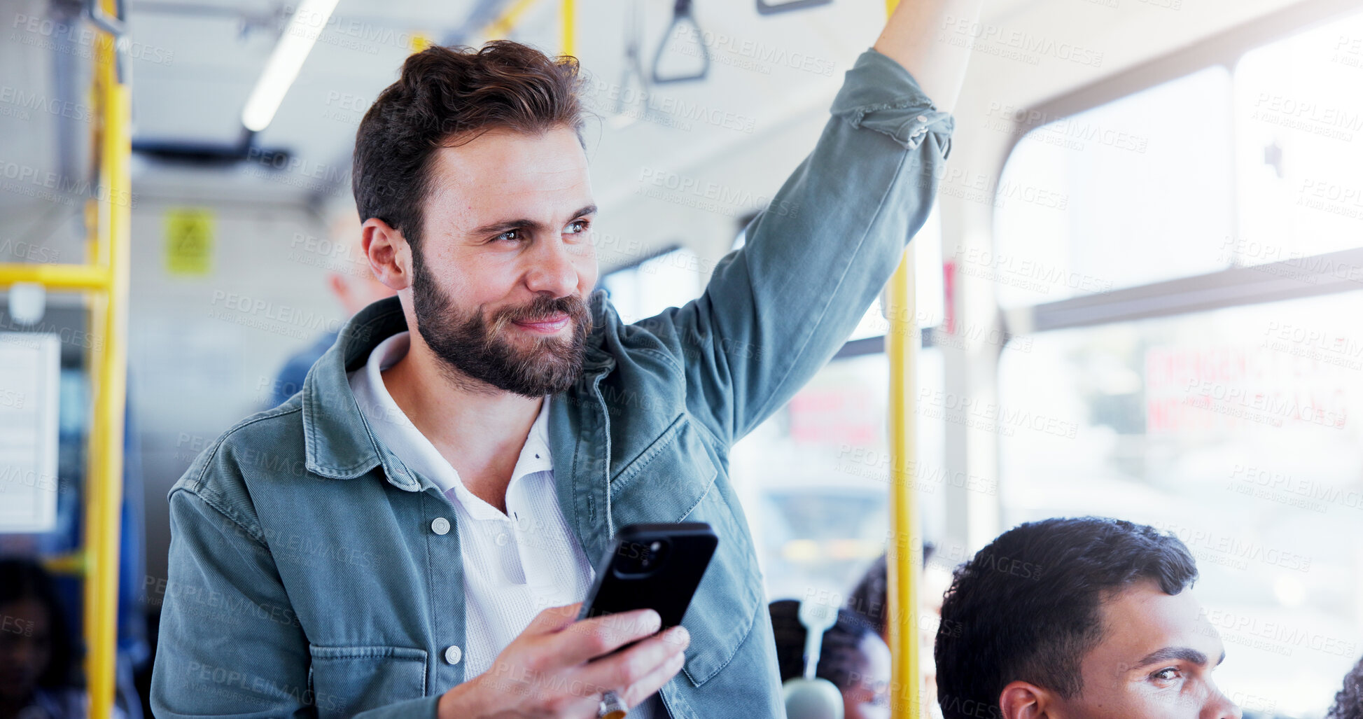 Buy stock photo Happy man, thinking and bus with phone for travel app, local commute or destination in city. Male person, tourist or traveler with smile on mobile smartphone in vehicle for public transport service