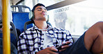 Man, headphones and sleeping in bust, travel and relax with streaming, tired and listening to music. Person, smartphone and subscription with fatigue, sound and rest with audio on public transport