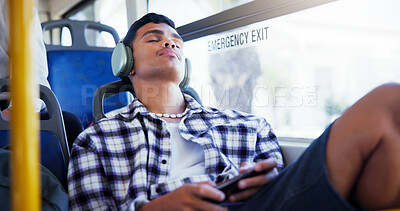 Buy stock photo Man, headphones and sleeping in bus, travel and relax with streaming, tired and listening to music. Person, smartphone and subscription with fatigue, sound and rest with audio on public transport