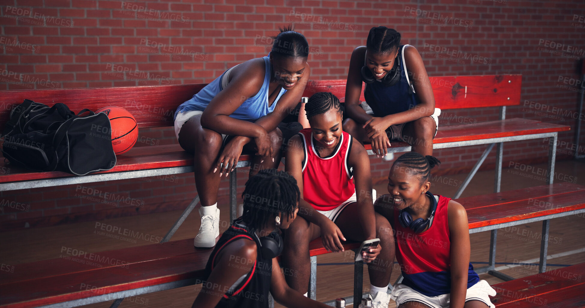 Buy stock photo Sports, athlete and group with mobile, happy and watching game on social media, streaming and break. Basketball player, team and black women with smartphone for videos, laughing and browsing on web