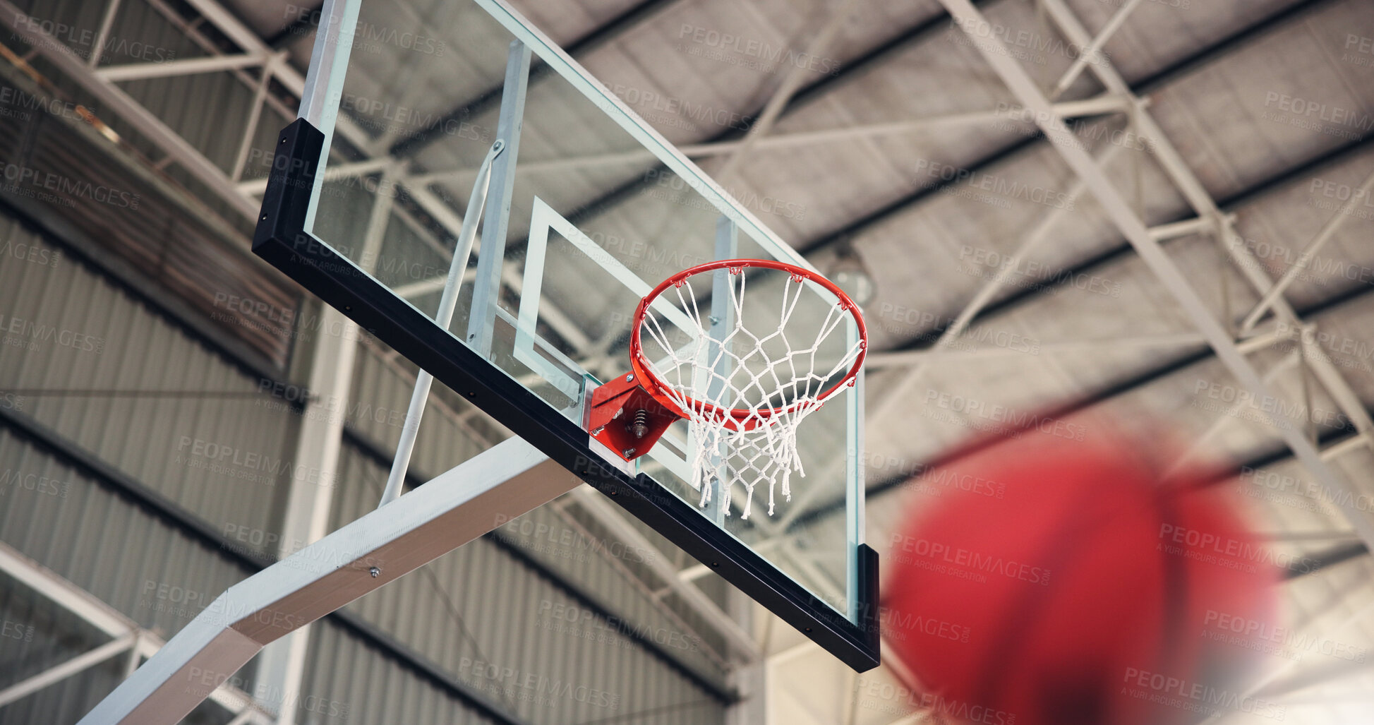 Buy stock photo Basketball, net and aim for game, court and points for competition, sports and motion for achievement. Low angle, action and win for match, hoop and successful target in university, stadium or event