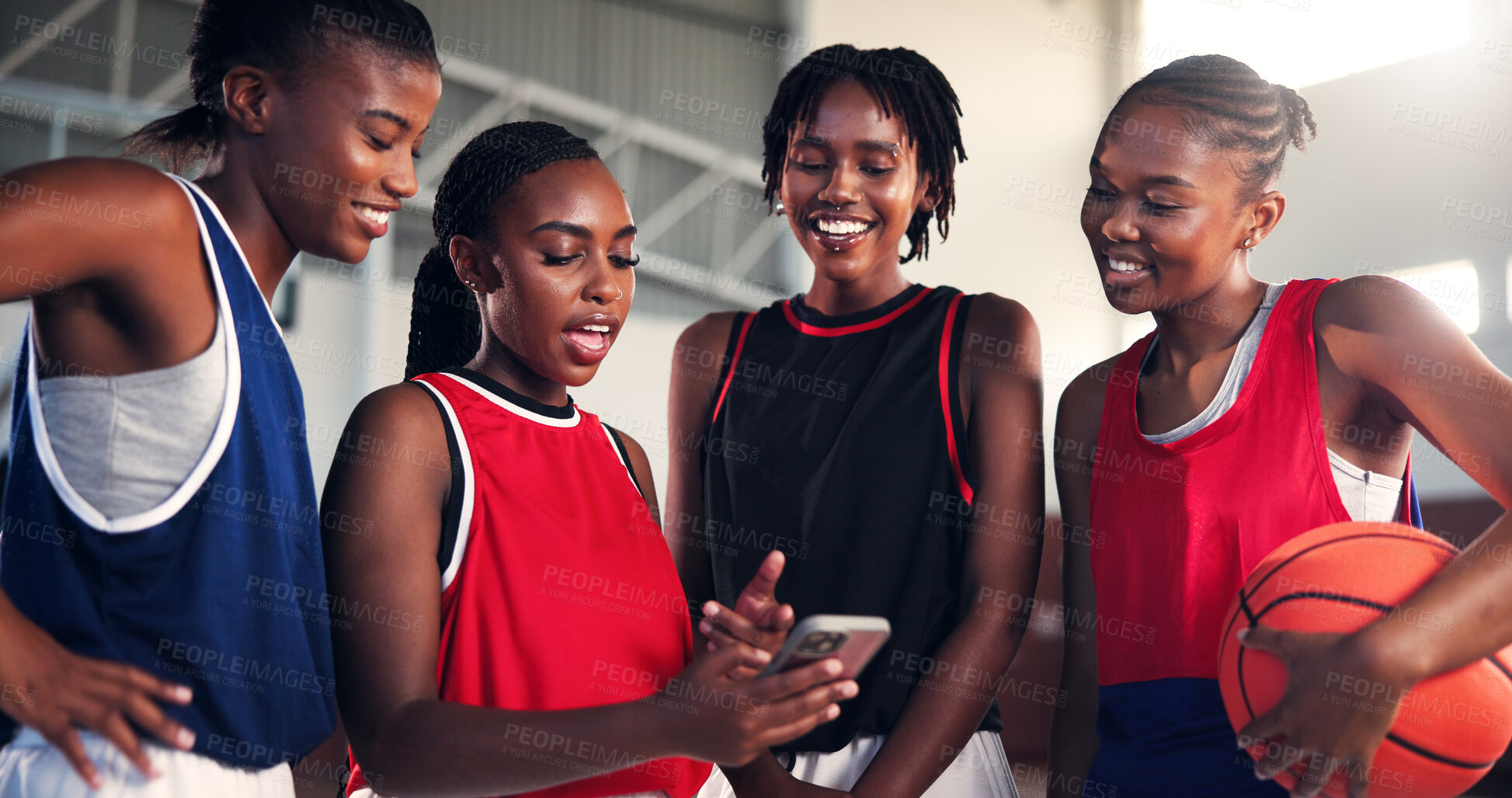 Buy stock photo Sports, online and girls with smartphone, basketball and watching game on social media, fun and team. Laughing, player and black people with mobile for videos, browsing and website for entertainment