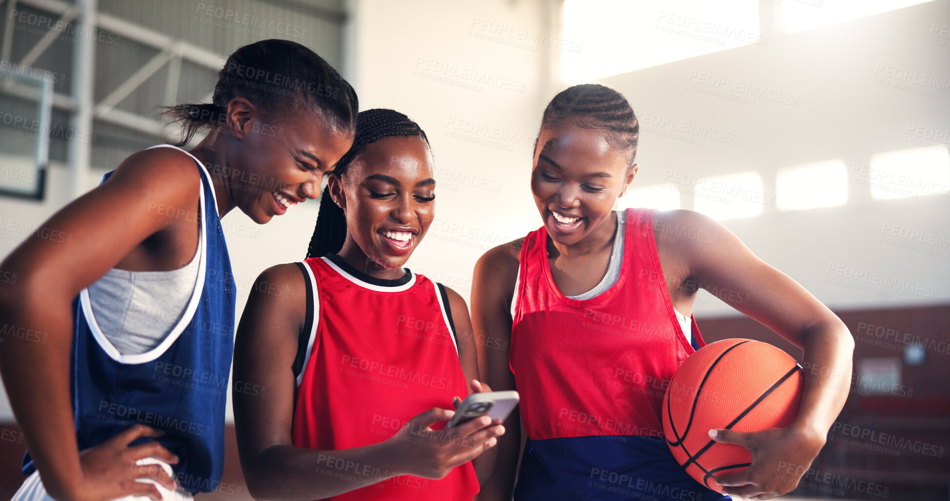 Buy stock photo Phone, friends and smile with women on basketball court for game plan, team training schedule and sports. Connection, athlete league results and app with people in gym for fitness and social media