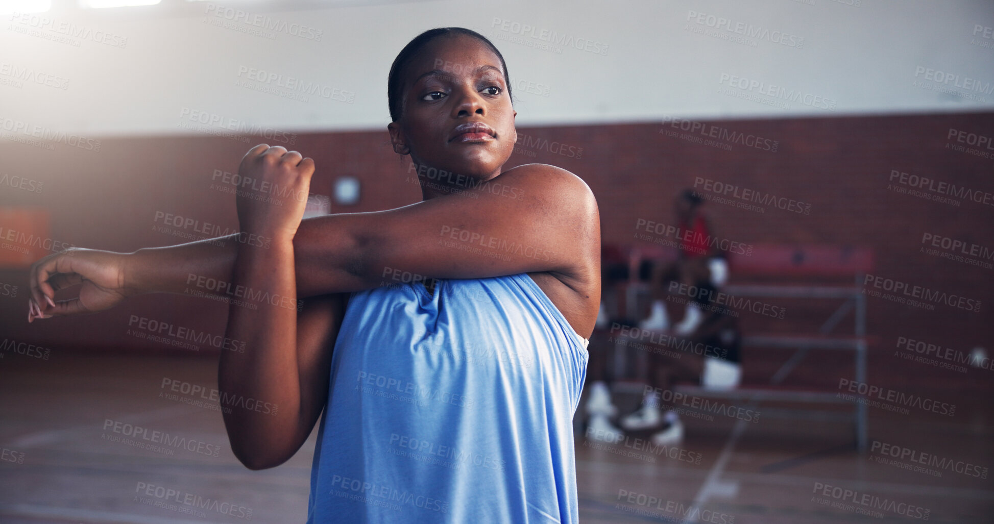 Buy stock photo Basketball, fitness and girl with stretching on court for match preparation, start tournament or game practice. Sport, player or arm warm up for performance, training or getting ready for competition