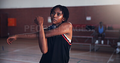 Buy stock photo Basketball, workout and girl with stretching on court for match preparation, tournament exercise and training. Sport, black woman and arm warm up for game wellness, fitness practice and getting ready