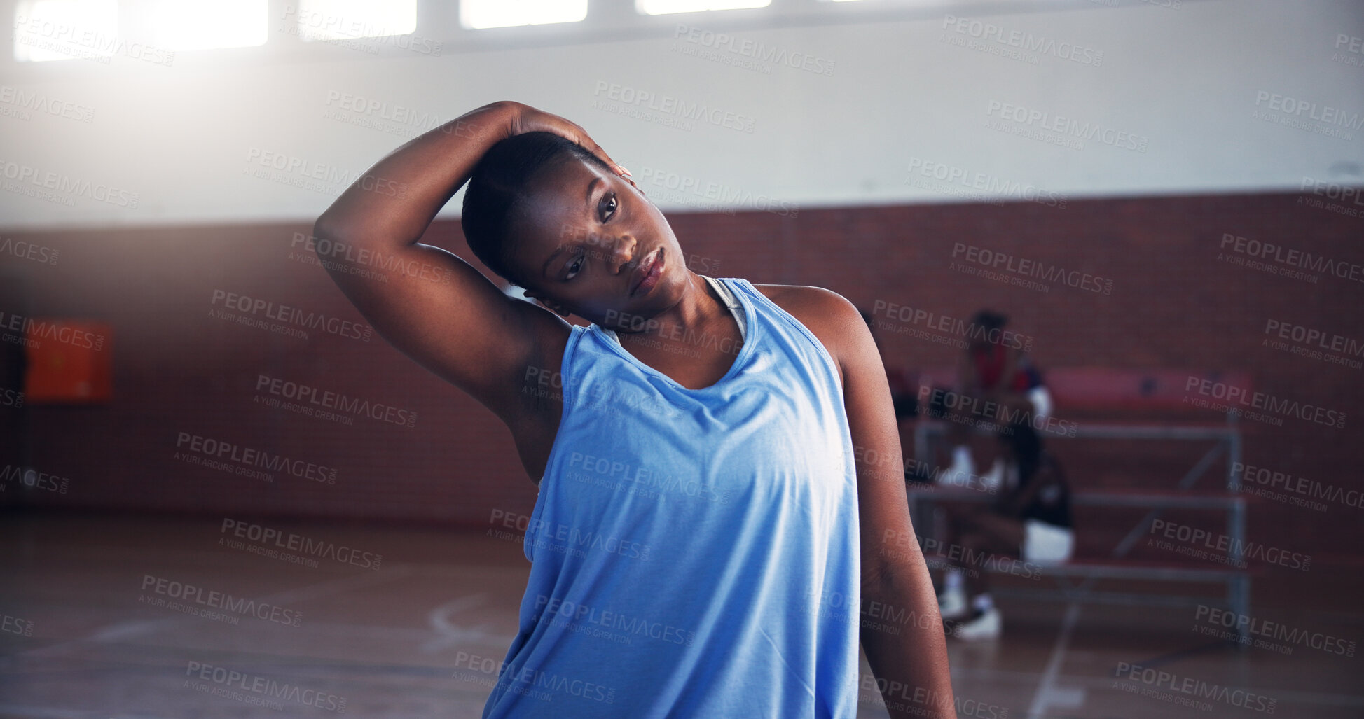 Buy stock photo Basketball, fitness and player with stretching on court for match practice, tournament preparation and exercise. Athlete, woman and neck warm up for game performance, getting ready or sport challenge