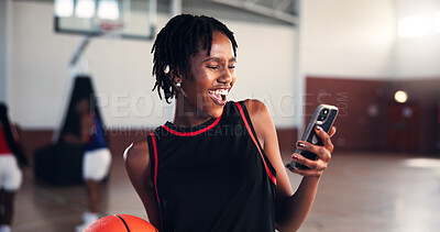 Buy stock photo Break, laughing and phone with basketball player on court for app, communication or social media. Fitness, sports and training with funny woman in gymnasium for competition, exercise or performance