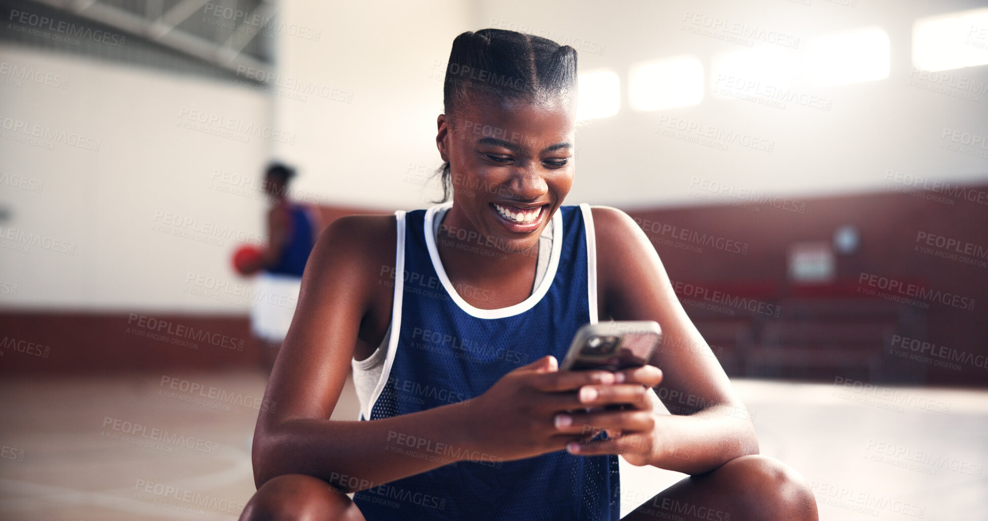 Buy stock photo Break, phone and smile of basketball player on court for app, communication or social media. Fitness, sports and training with happy black woman in gymnasium for competition, exercise or performance