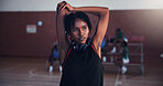 Basketball, fitness and girl with stretching on court for match preparation, tournament exercise and headphones. Workout, player and arm warm up for game performance, sport practice and getting ready