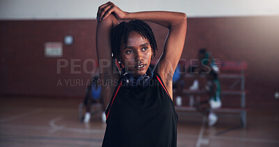 Buy stock photo Basketball, fitness and girl with stretching on court for match preparation, tournament exercise and thinking. Workout, player and arm warm up for game performance, sport practice and getting ready