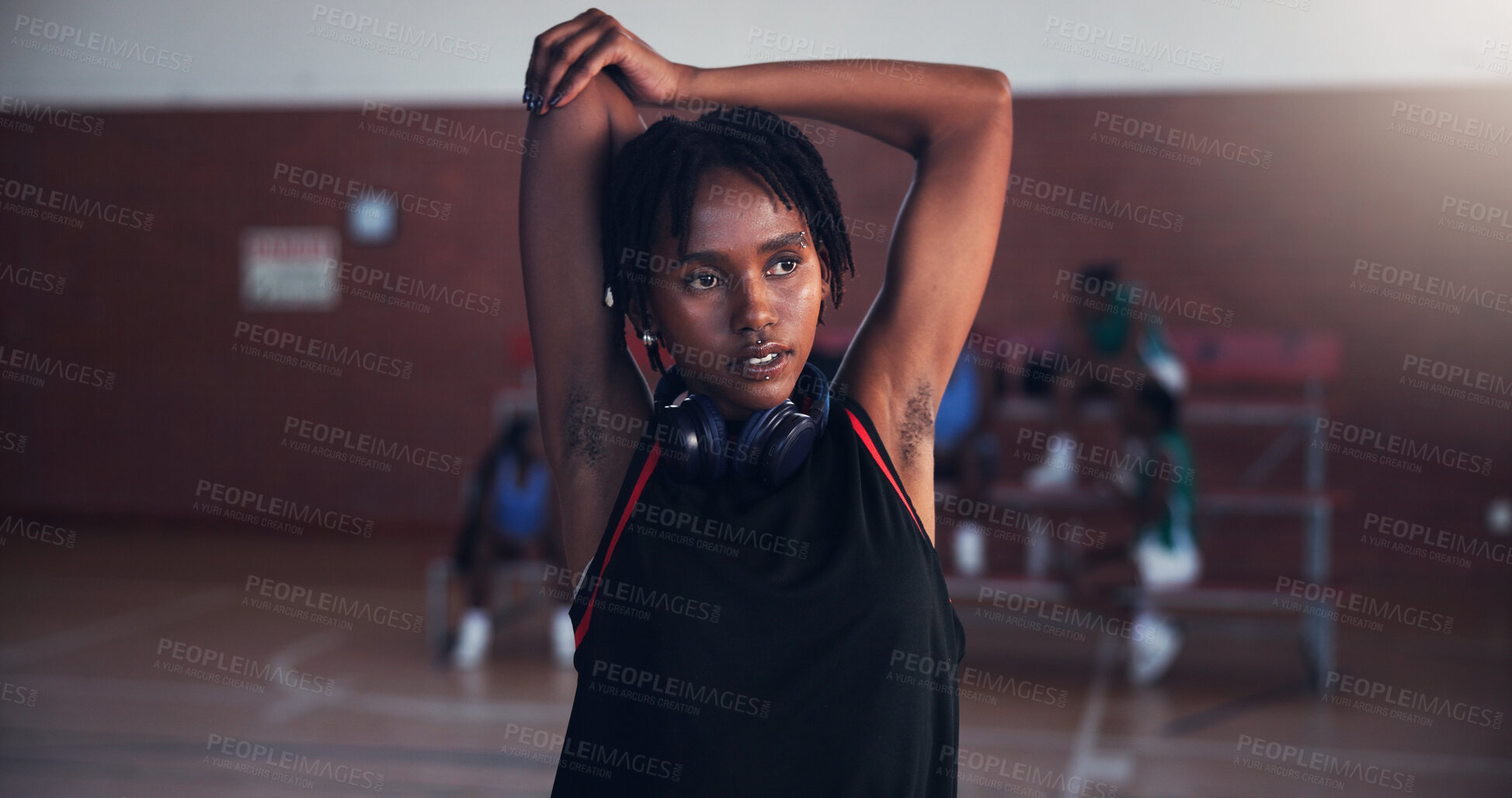 Buy stock photo Basketball, fitness and girl with stretching on court for match preparation, tournament exercise and thinking. Workout, player and arm warm up for game performance, sport practice and getting ready