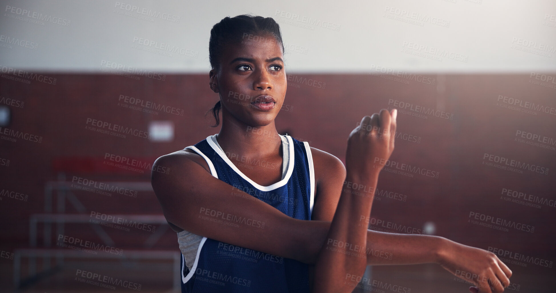 Buy stock photo Basketball, workout and woman with stretching on court for game preparation, tournament exercise and practice. Sport, black person and arm warm up for match performance or getting ready for challenge
