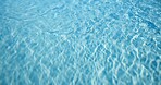 Blue, water and ripple with waves in pool for natural element, aqua hydration or swimming area. Empty, space and pattern with liquid texture, reflection or abstract light for summer holiday or travel
