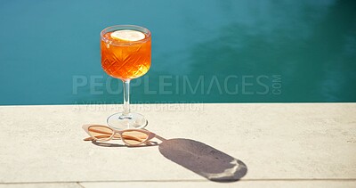 Buy stock photo Cocktail, space and swimming pool with sunglasses and alcohol for summer holiday or vacation. Travel, resort and drink by water for outdoor luxury, hotel hospitality and shades to relax or chill