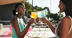 Cocktail, toast and women at resort for summer holiday or vacation. Travel, alcohol and cheers with drink of friends for outdoor luxury, hotel hospitality and break to relax, celebrate or chill