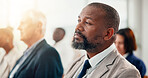 Seminar, audience and man listening to business conference with employees or team in crowd. Event, feedback and group of people in meeting, presentation or training for corporate career at company