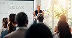 Speech, award and woman with business people in office for sustainable, eco friendly company and solar energy. Corporate event, convention and speaker with trophy for thank you, celebrate and success