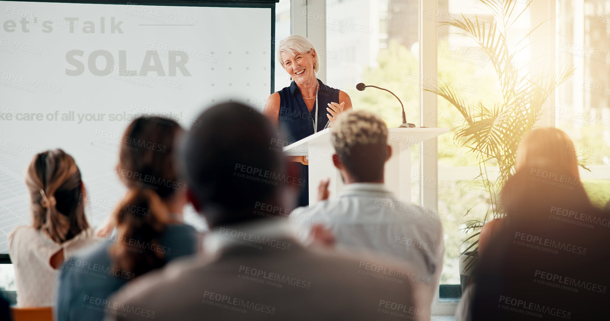 Buy stock photo Speech, solar and woman with business people in office for sustainable, eco friendly company and renewable energy. Corporate event, convention and speaker for thank you, celebration and success