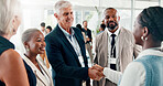 Conference, handshake and networking with business people at event for global forum, investor summit and meeting. Welcome, b2b convention and expo with employees in lobby for brand exposure seminar