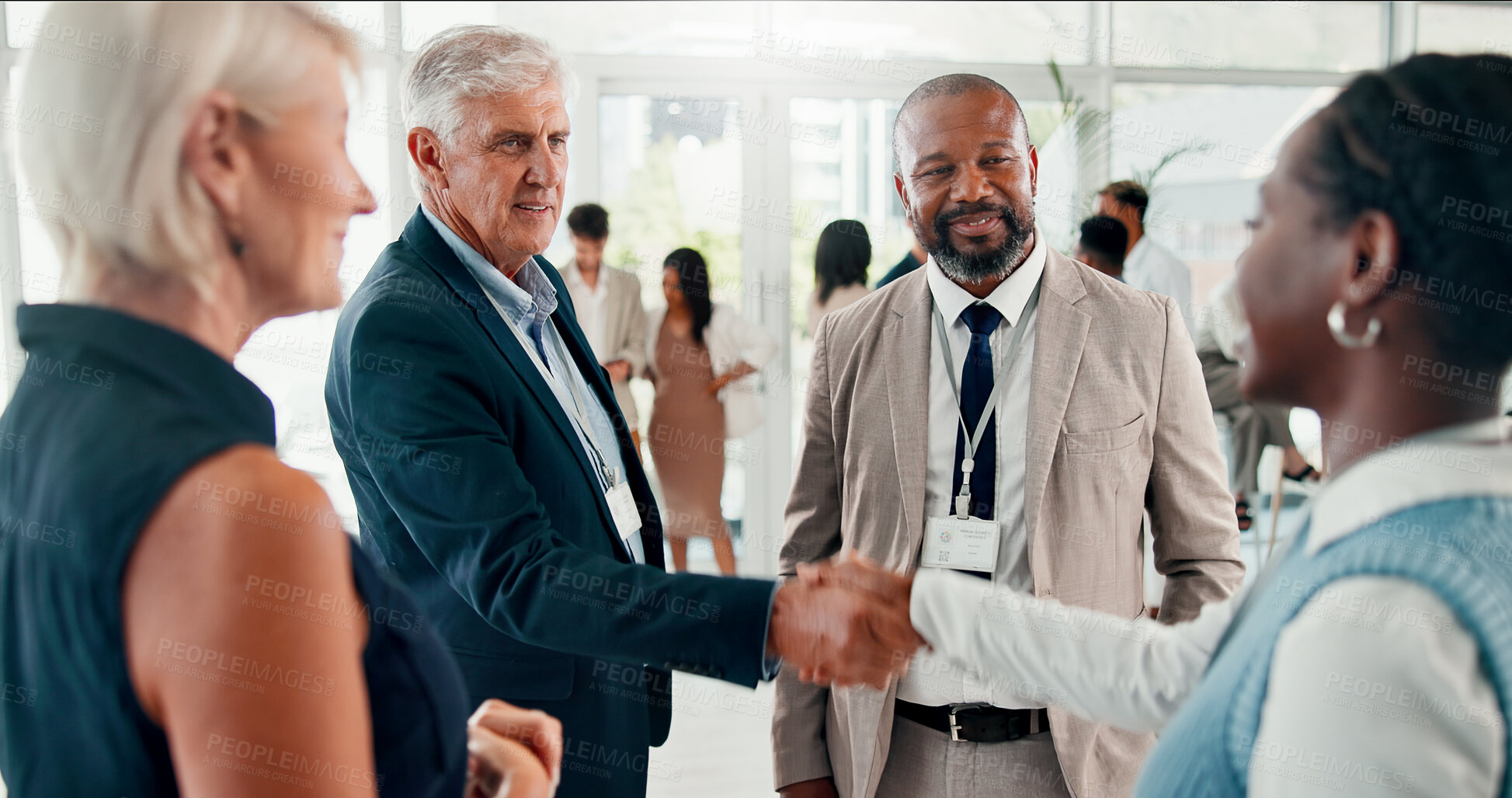 Buy stock photo Conference, handshake and meeting with business people at event for global forum, investor summit and networking. Welcome, b2b convention and expo with employees in lobby for brand exposure seminar