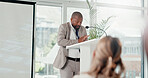 Presentation, office and man with business people for conference, training and meeting. Corporate speaker, discussion and worker on podium in workshop, convention and seminar for financial coaching