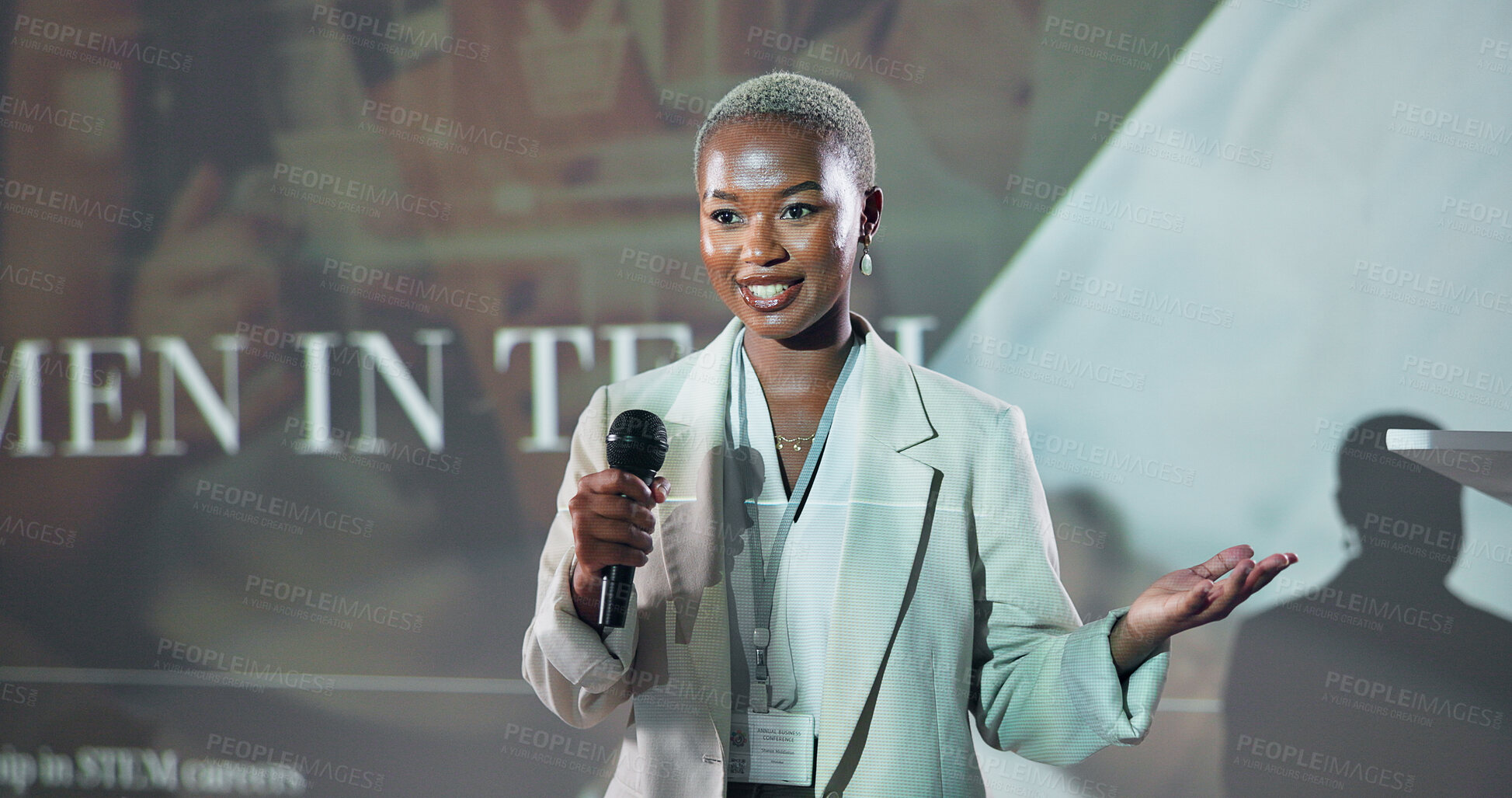 Buy stock photo Business, speech and black woman at conference for motivation at tech seminar with mic. Convention, presentation and keynote speaker at event for story, advice and inspiration with happy programmer