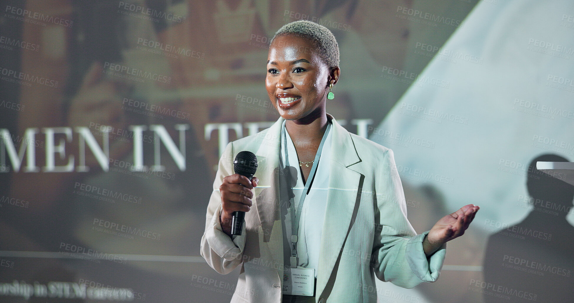 Buy stock photo Business, speech and black woman at seminar for motivation at tech conference with mic. Convention, presentation and keynote speaker at event for story, advice and inspiration with happy programmer